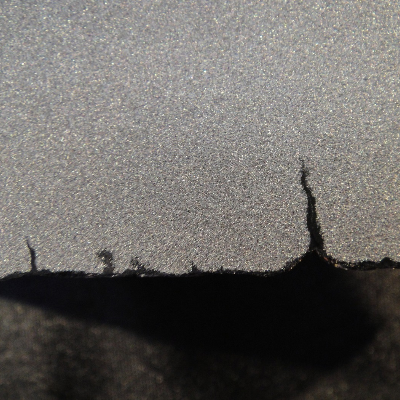 Detail of figure 2, showing multiple fatigue cracks due to thermal cycles.