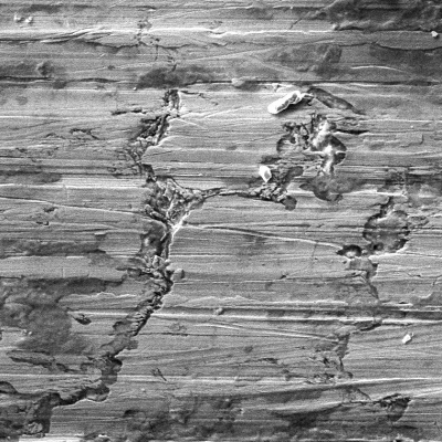 External surface aspect of the flange showing preferential dissolution, responsible for nucleation of the through wall cracking.