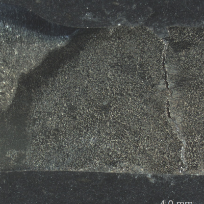 Macrography transverse to the circunferential weld, longitudinal to the piping, presenting the location, a little far from the welded joint margin,  where the through wall cracking is positioned.