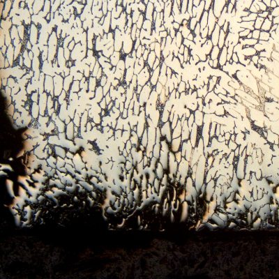 Longitudinal section micrography at the cracked position, close to the internal surface of the flange (exposed to the corrosive fluid), showing preferential dissolution associated to the microstructure.
