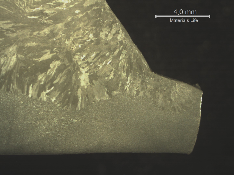 Macro transverse to the weld showing that the fracture occurred in the main pipe, at the margin of the weld.