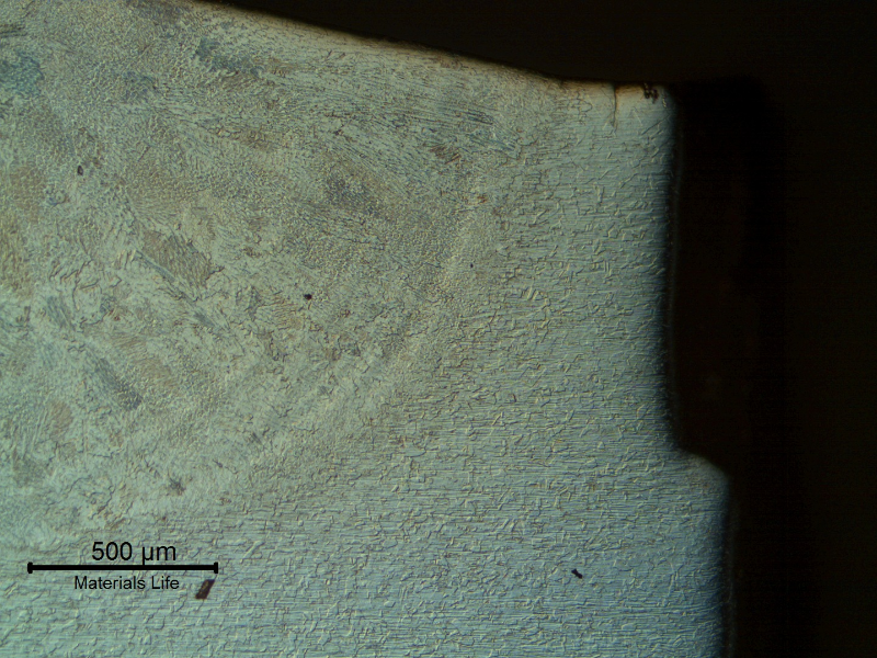Micrography transverse to the weld and to the fracture surface (right side of the figure).