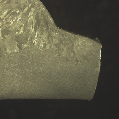 Macro transverse to the weld showing that the fracture occurred in the main pipe, at the margin of the weld.