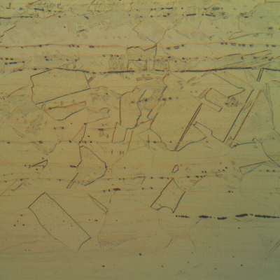 Longitudinal section of the main pipe showing as austenitic structure with small amount of delta ferrite, aligned (black dots).
