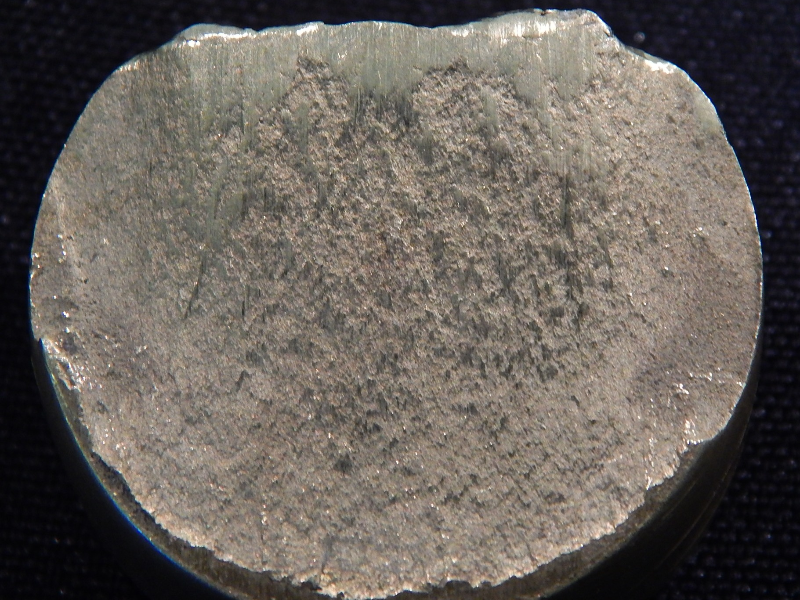 The fracture surface is flat and smashed due to the shearing action.