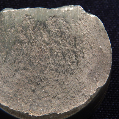 The fracture surface is flat and smashed due to the shearing action.