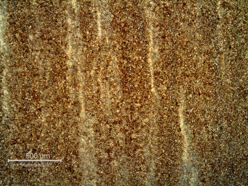 Micrography of the longitudinal section of the pin showing a tempered martensite structure, with bands that are associated to segregations. The pin presented average hardness of 38 HRc in the section.