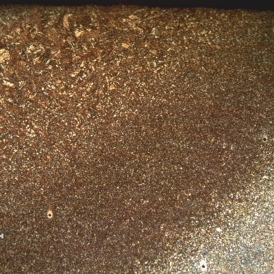 Low magnification micrography of a transverse section of the weld at the heat affected zone region. 
The macrosection was hardness tested and the base metal hardness is 27HRc, the HAZ is 32HRc and the weld metal is 45HRc, revealing something wrong in the weld metal at the position close to the cracked area.