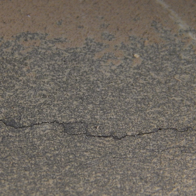 The fitting presented through wall cracks that lead to leaking.  The internal aspect of the surface is presented where the cracks were still in the begining.