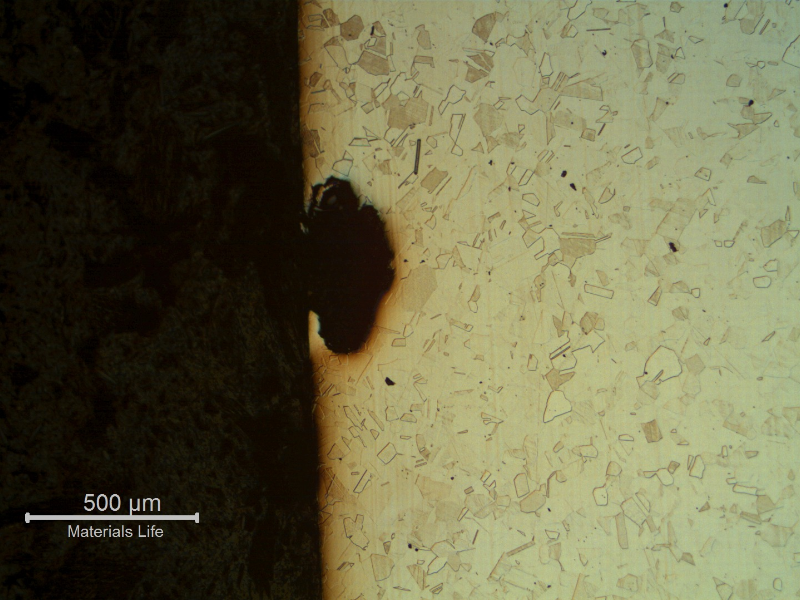 Micrography of the pipe in a longitudinal section, close to the external surface, showing a pit (adjacent to the through wall cracking). The corrosion spt is not associated to any microstructural feature.