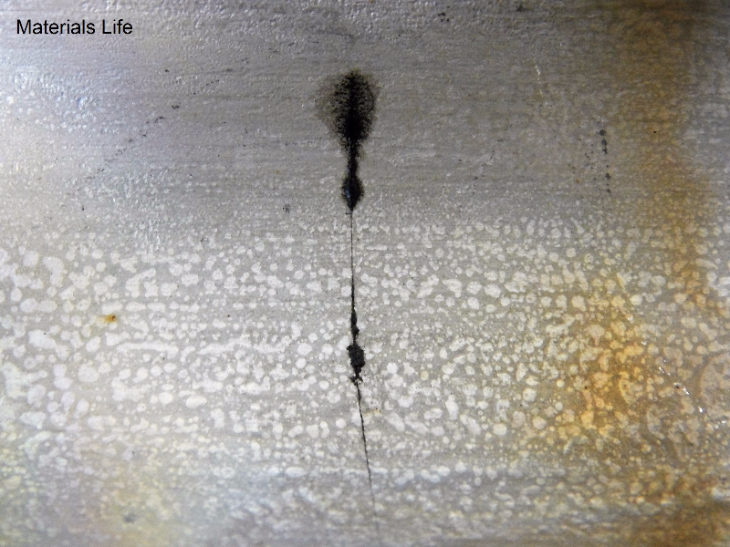 Aspect of the internal surface of the 2" nominal diameter pipe, SCH 40, presenting a circumferential through wall cracking in the pipe, not associated to any of the welded joints. It is possible to see the cracking parallel to the two welded joints: the pipe to weldolet (left side of the figure); and the pipe to flange (right side of the figure).