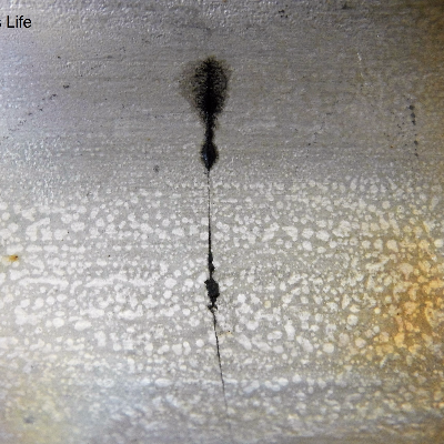Aspect of the internal surface of the 2" nominal diameter pipe, SCH 40, presenting a circumferential through wall cracking in the pipe, not associated to any of the welded joints. It is possible to see the cracking parallel to the two welded joints: the pipe to weldolet (left side of the figure); and the pipe to flange (right side of the figure).