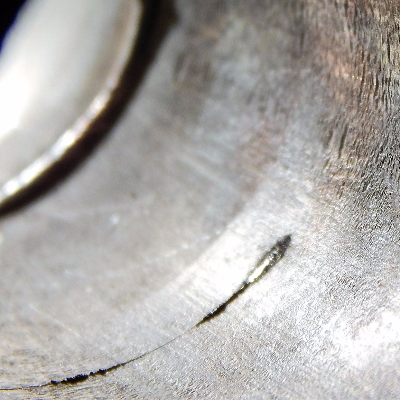 Aspect of the internal surface of the 2" nominal diameter pipe, SCH 40, presenting a circumferential through wall cracking in the pipe, not associated to any of the welded joints. It is possible to see the cracking parallel to the two welded joints: the pipe to weldolet (left side of the figure); and the pipe to flange (right side of the figure).