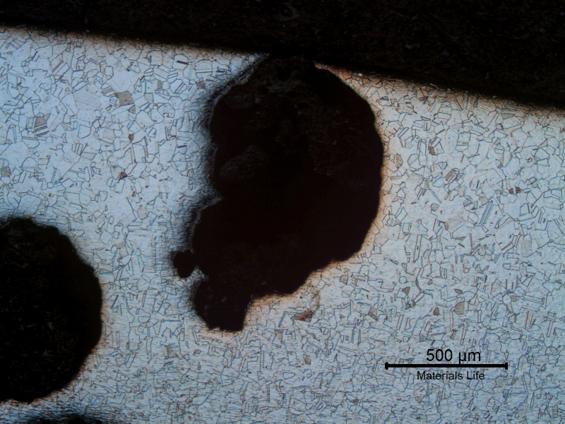 Micrography of a transverse section of the pipe, presenting the pitting corrosion. As polished.