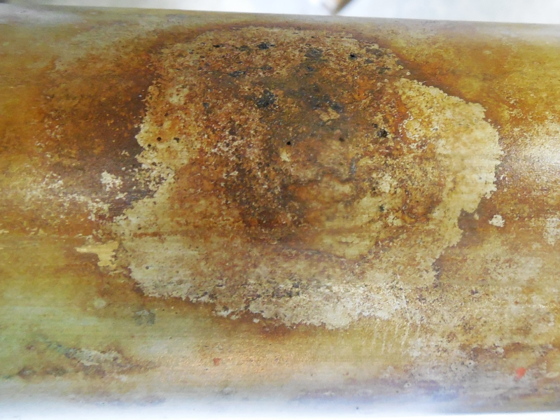 The external surface of the 2" diameter pipe is rusted and the leakage is associated to “holes” that appear very small at the surface but that open a large hole in the middle of the thickness.