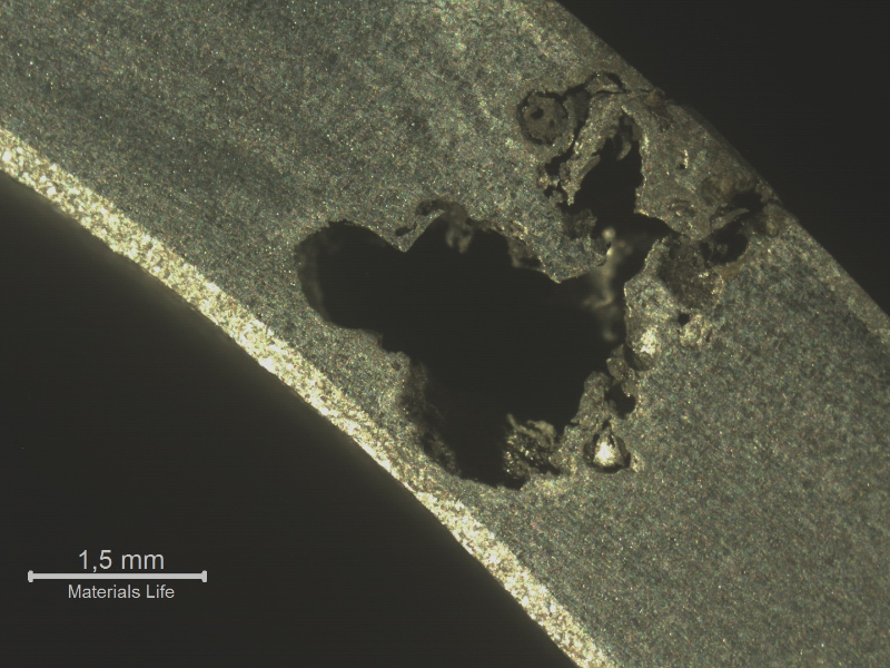 Transverse section of the 2" diameter pipe at the pitting location. The pipe was leaking.