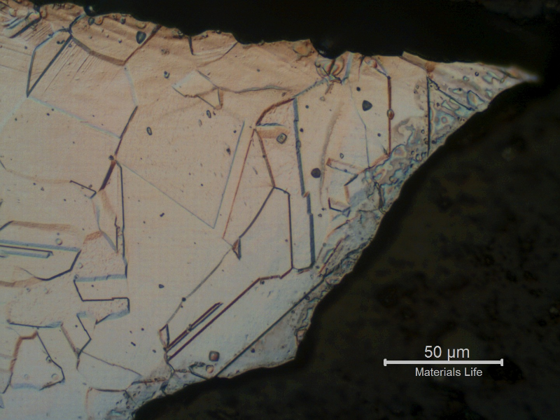 Austenitic structure, free from carbides, exactly in the region of the pitting, indicating that the corrosion is not associated to the material microstructure.