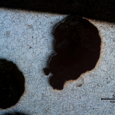 Micrography of a transverse section of the pipe, presenting the pitting corrosion. As polished.