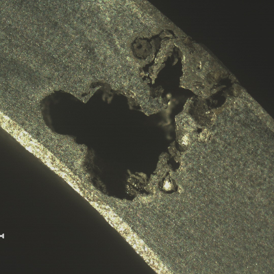Transverse section of the 2" diameter pipe at the pitting location. The pipe was leaking.