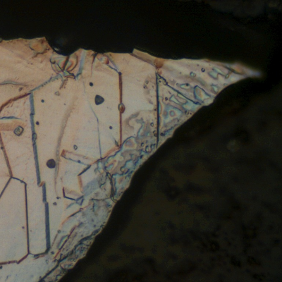 Austenitic structure, free from carbides, exactly in the region of the pitting, indicating that the corrosion is not associated to the material microstructure.
