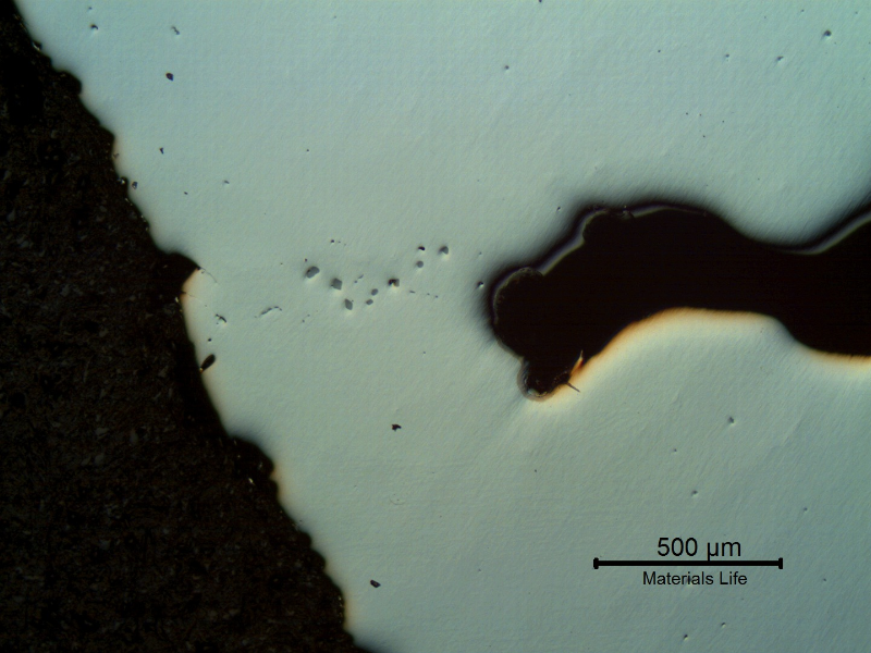 Micrographic detail of the defect (void in the right side of the figure), as polished. In the left side it is the surface of the water blade and there are some non metalic inclusions in this region.