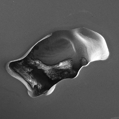 Region of a casting void in the blade. As polished.