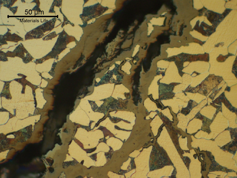 Typical branched stress corrosion cracks in a low carbon steel, ferritic-pertlitic structure. The cracks are filled with corrosion products.
