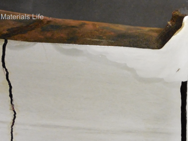 The macrography of a longitudinal section of the shell plate (sample removed from the boiler), at the position of the fillet weld (sealing weld) with a tube, where surface welding repairs created conditions for cracking the base material in a transgranular morphology. Several cracks were identify starting from the steam drum internal surface.