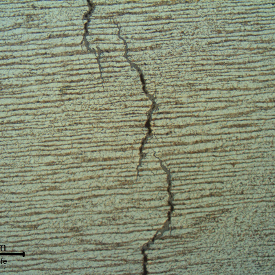 Micrography of the cracking showing the branched nature, typical of a stress corrosion cracking. The cracks started from the internal surface of the steam drum.