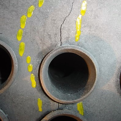Steam drum presenting cracks in the shell, connecting tube holes.