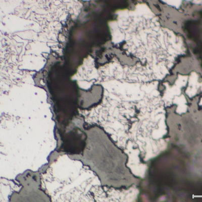 Detail of the intergranular stress corrosion cracking of the drum shell weld repair.