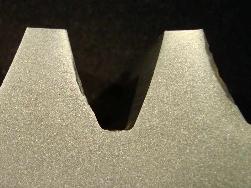 The macrography of the transverse tooth section of the SPUR GEAR shows that the surface is not hardened by any process or treatment.