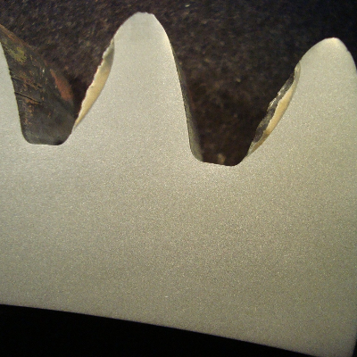 The macrography of the transverse tooth section of the SPUR GEAR shows that the surface is not hardened by any process or treatment.