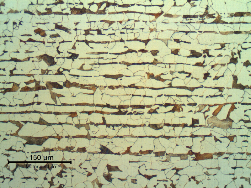 Ferritic-perlitic microstructure of a longitudinal section of the plate that was qualified to be adopted in a tubesheet boiler. Hot formed plate presenting perlite banding.