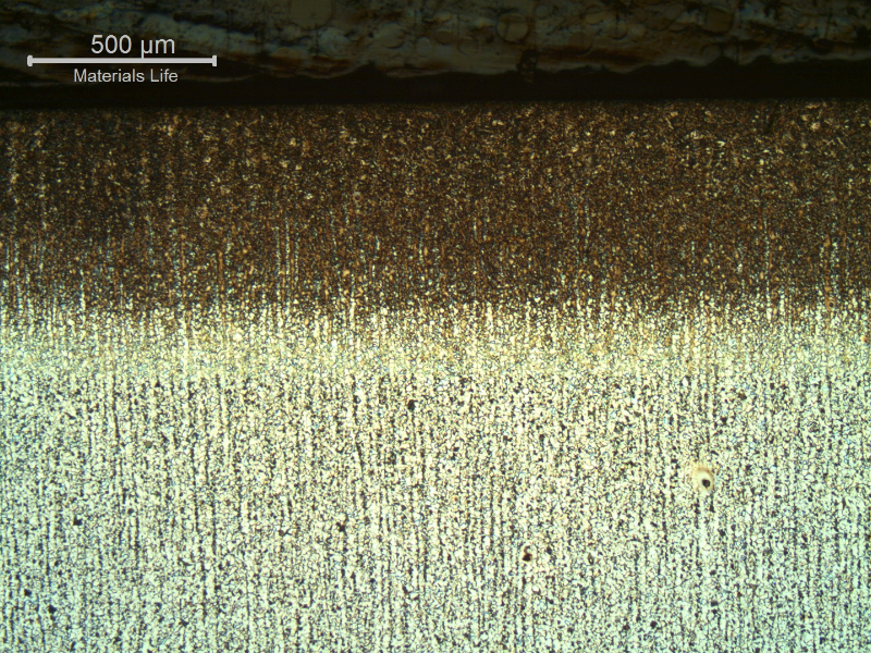 Micrography of a section transverse to the Oxygen Plasma Cut surface, showing the zone affected by the heat generated in the cutting. The extension of the HAZ is about 0.5 mm.  The cut was conducted in the 1 1/4" thickness of the plate.
