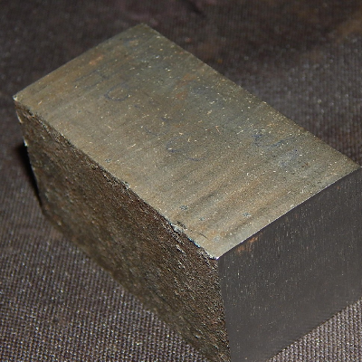 Macroscopic aspect of the cutting surface, slightly irregular. The structural plate is 1 1/4" thick.