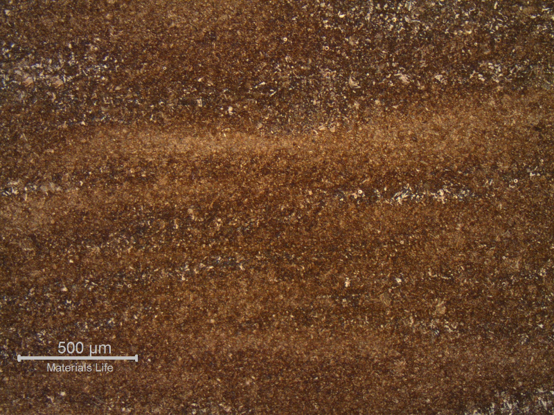 The micrography in the longitudinal section in the middle of the thickness shows a light banding. Quenched and tempered structure.