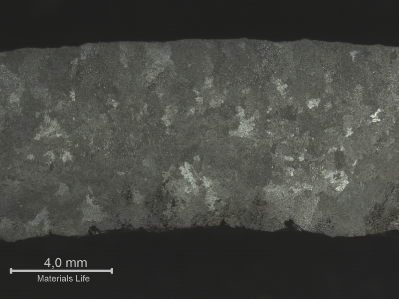 Macrography of the NEW TUBE, centrifugally cast, in the transverse section, presenting columnar grains close to the external surface.