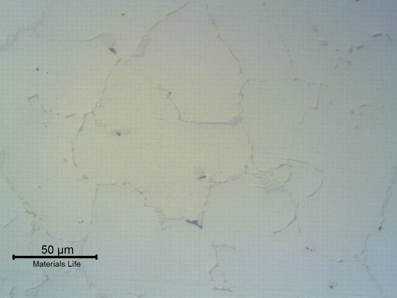 The micrography in the as polished condition of the NEW TUBE shows that there are no casting defects in the center of the thickness.