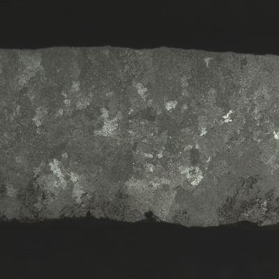 Macrography of the NEW TUBE, centrifugally cast, in the transverse section, presenting columnar grains close to the external surface.