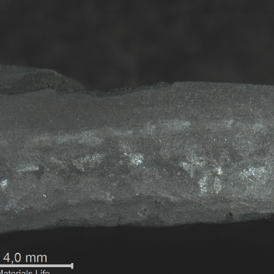 Macrography of the TUBE REMOVED FROM SERVICE, centrifugally cast, in the transverse section, presenting thickness loss and macrostructure deterioration.