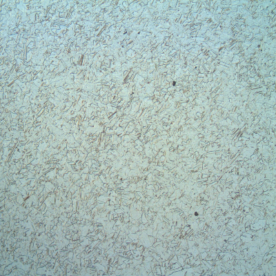 The micrography of a transverse section of the shaft shows the granular austenitic structure close to the surface of the shaft.