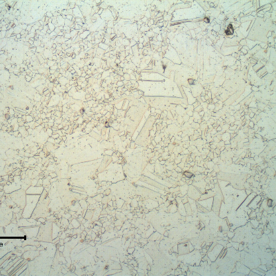 The micrography of a transverse section of the shaft shows a duplex grain size structure in the center of the shaft.  This conditions was probably generated due to the delta phase presented in segregated bands in the center of the original bar.