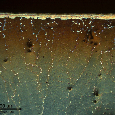 Micrography close to the surface of the blade, showing the diffusion coating (aluminum base alloy) that is still sound. No strong oxidation or erosion was detected.