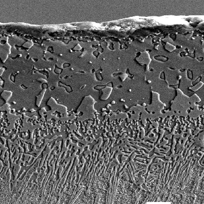 Micrographic detail of the diffusion coating. H2SO4 + HNO3 + H3PO4 etched.