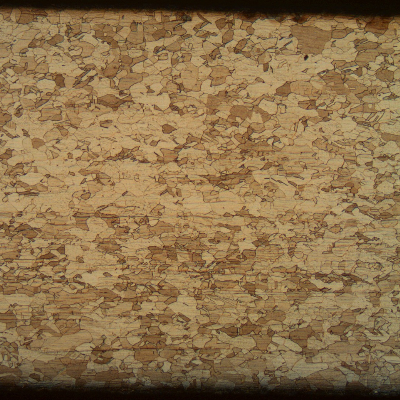 The micrography of the tube shows a granular structure and light deformation lines. No evidences of corrosion from the external surface (upper side of the figure) or internal surface (lower side of the figure).