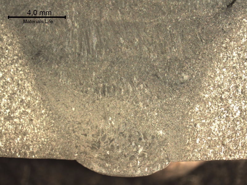 Macrography of the welded joint, at the root position, presenting the different zones studied in this ML. Transverse section. See the schematic drawing in the next image.
