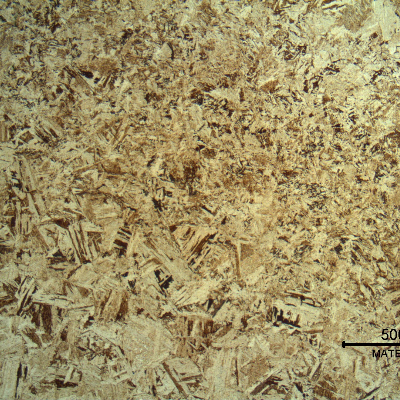 Micrography of the heat-affected zone. The fusion line is in the right and the coarse structure of the base metal is refined at the heat affected zone.
