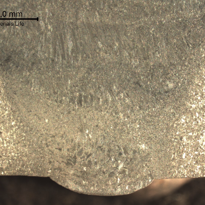 Macrography of the welded joint, at the root position, presenting the different zones studied in this ML. Transverse section. See the schematic drawing in the next image.