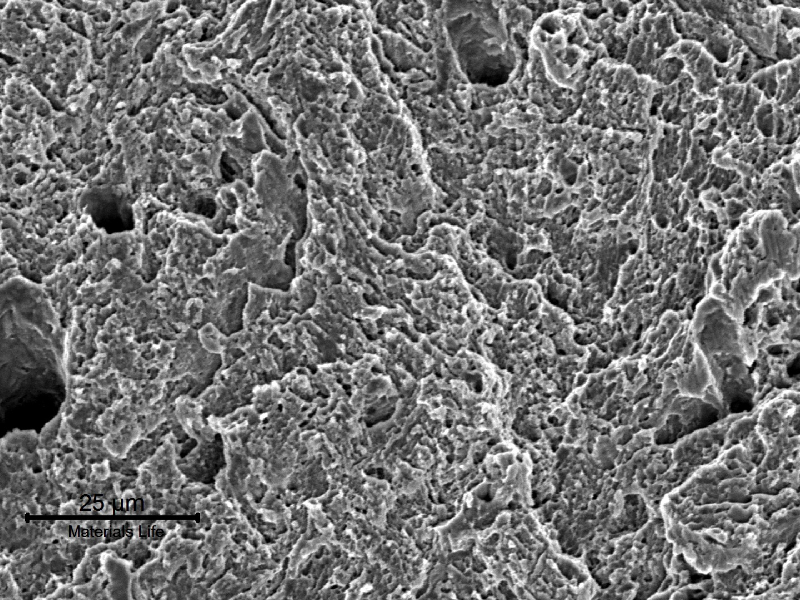 Fracture appearance in a sheared region, presenting a ductile morphology for the fracture micromechanism.